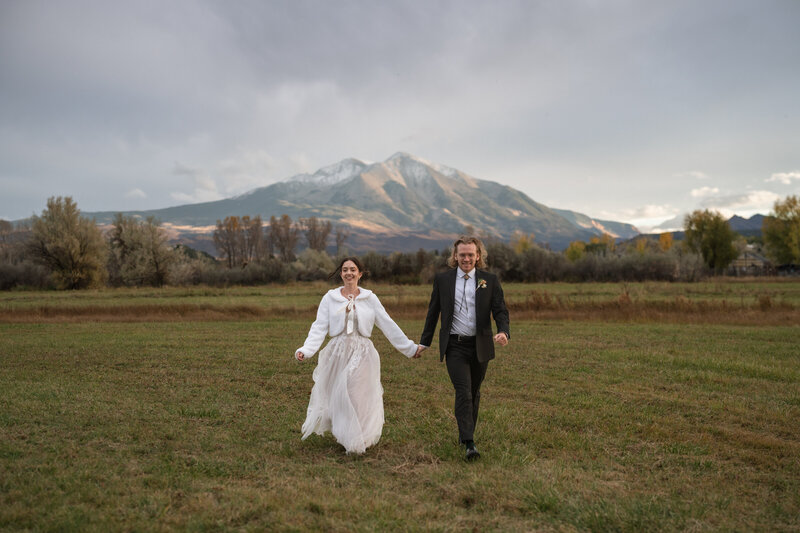 Couple during grand exit with confetti.