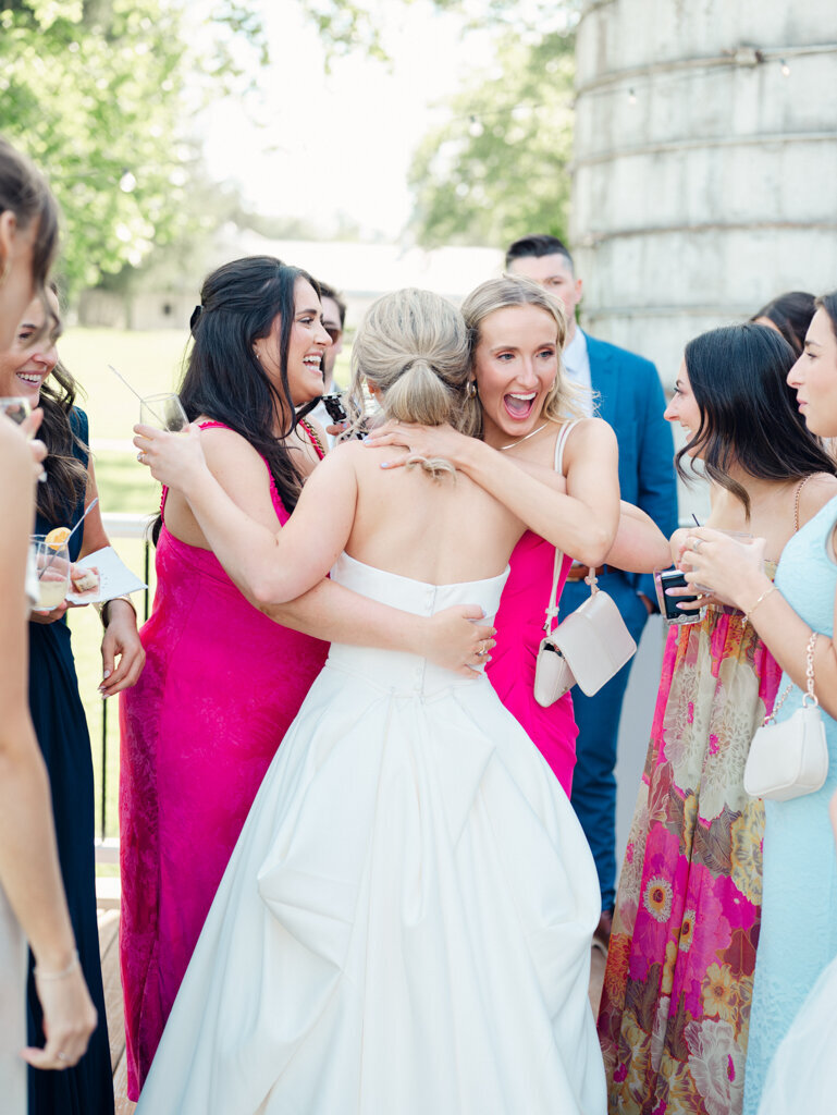 friends excited to greet their bride, taken by baltimore wedding photographer Nicole Simensky