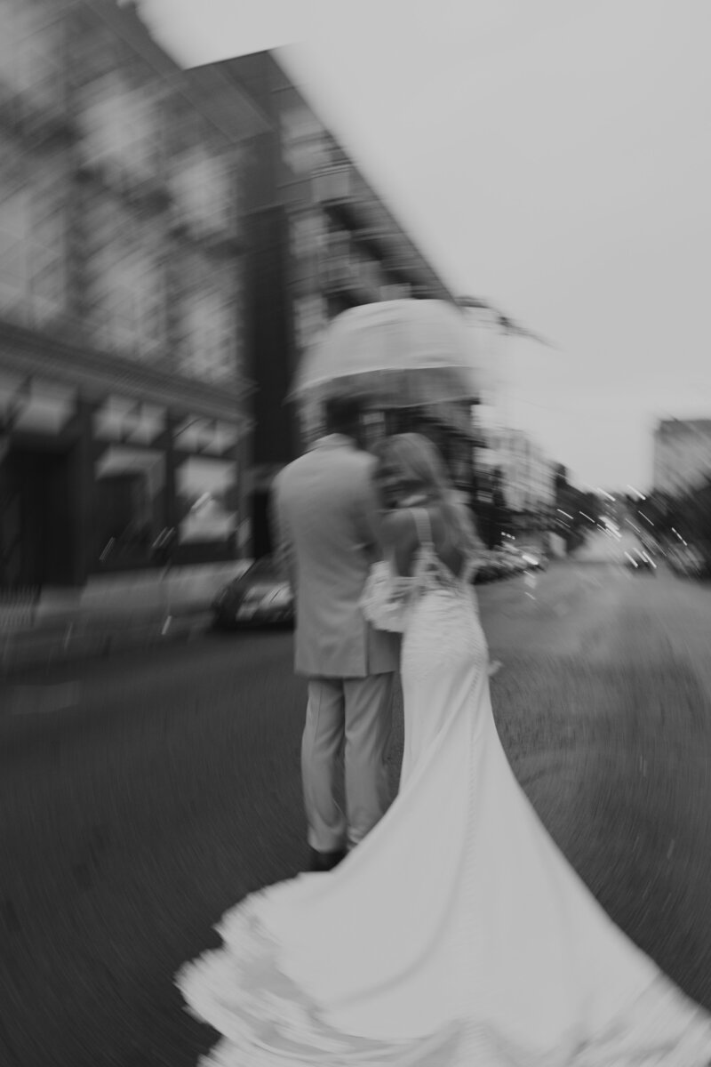 black and white blurry wedding day for this couple. Rainy and cloudy wedding day in downtown kansas city missouri.