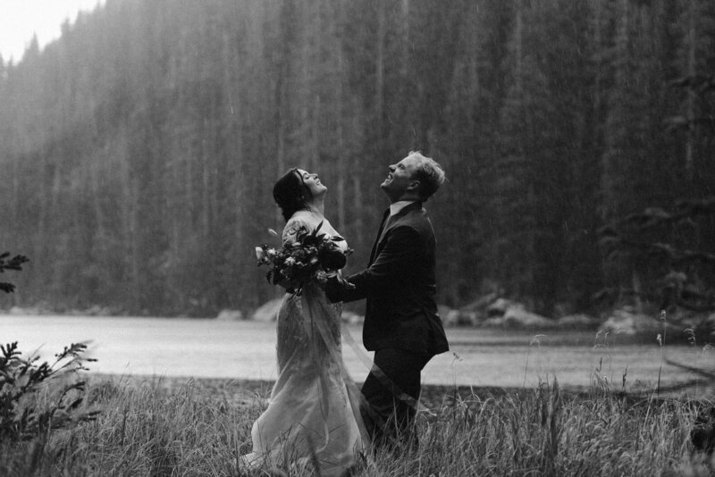 Couple laughing in the rain during their Estes Park elopement
