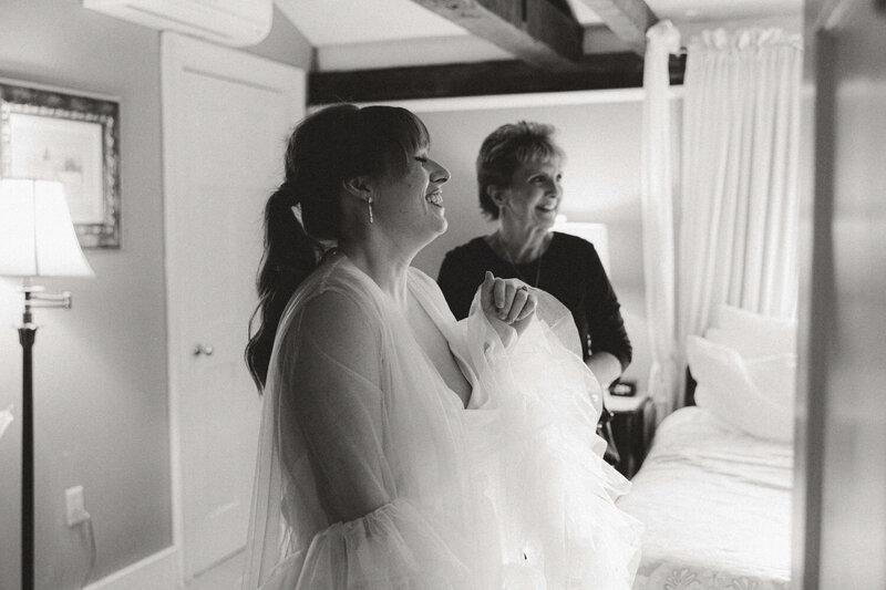 Black and white photo of a bride and a woman