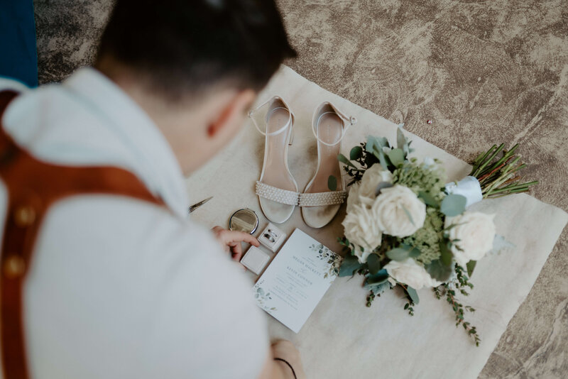 Wedding photographer and videographer Jonathan Pajak taking a photo of wedding details.