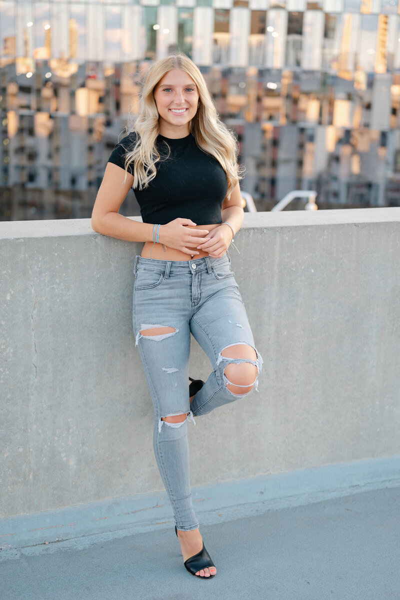 Senior photoshoot on a rooftop in downtown Detroit.