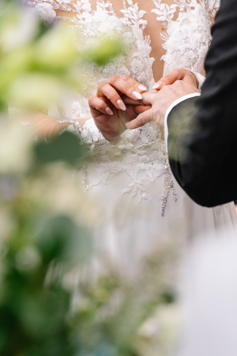 Ring exchange between the bride and groom at the wedding ceremony. 