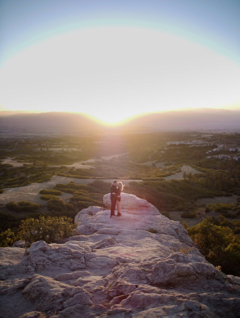 Couple standing on a cliff in Colorado