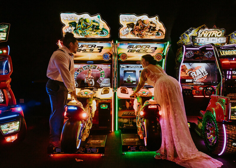 bride and groom at an arcade after eloping in colorado