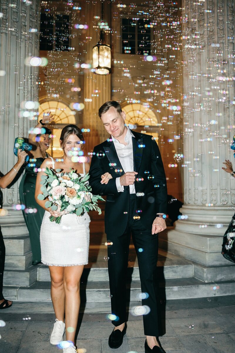 Elegant Couple leaves wedding under bubble exit at the DAR Constitution Hall