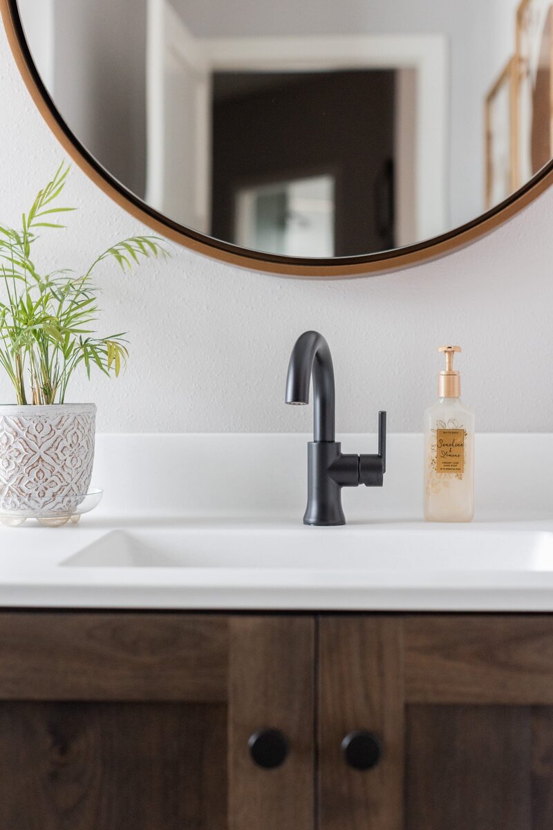 michele rosenboom design modern farmhouse bathroom black faucet and round mirror