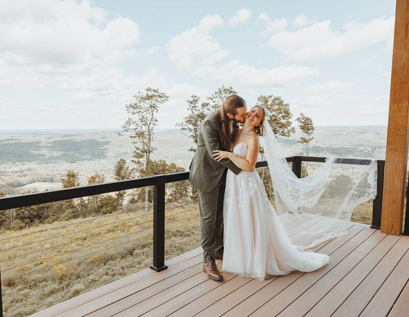 couple kissing on the cheek