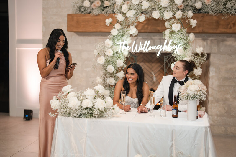 maid of honor makes the wedding guests laugh with a funny speech for the newlyweds