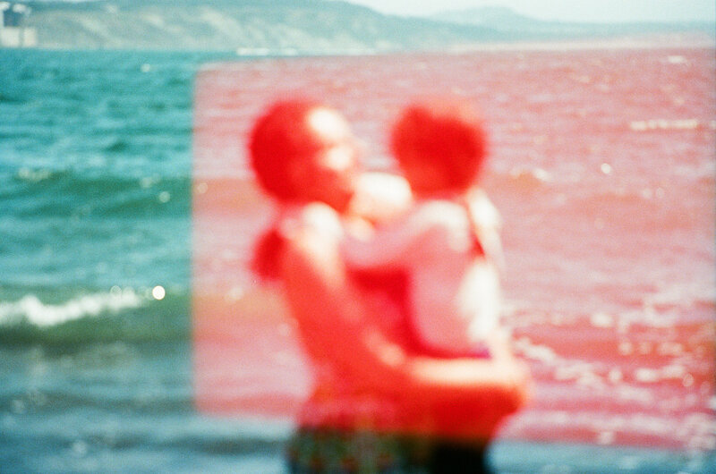 multiple exposure photo of mom with two sons on a bed