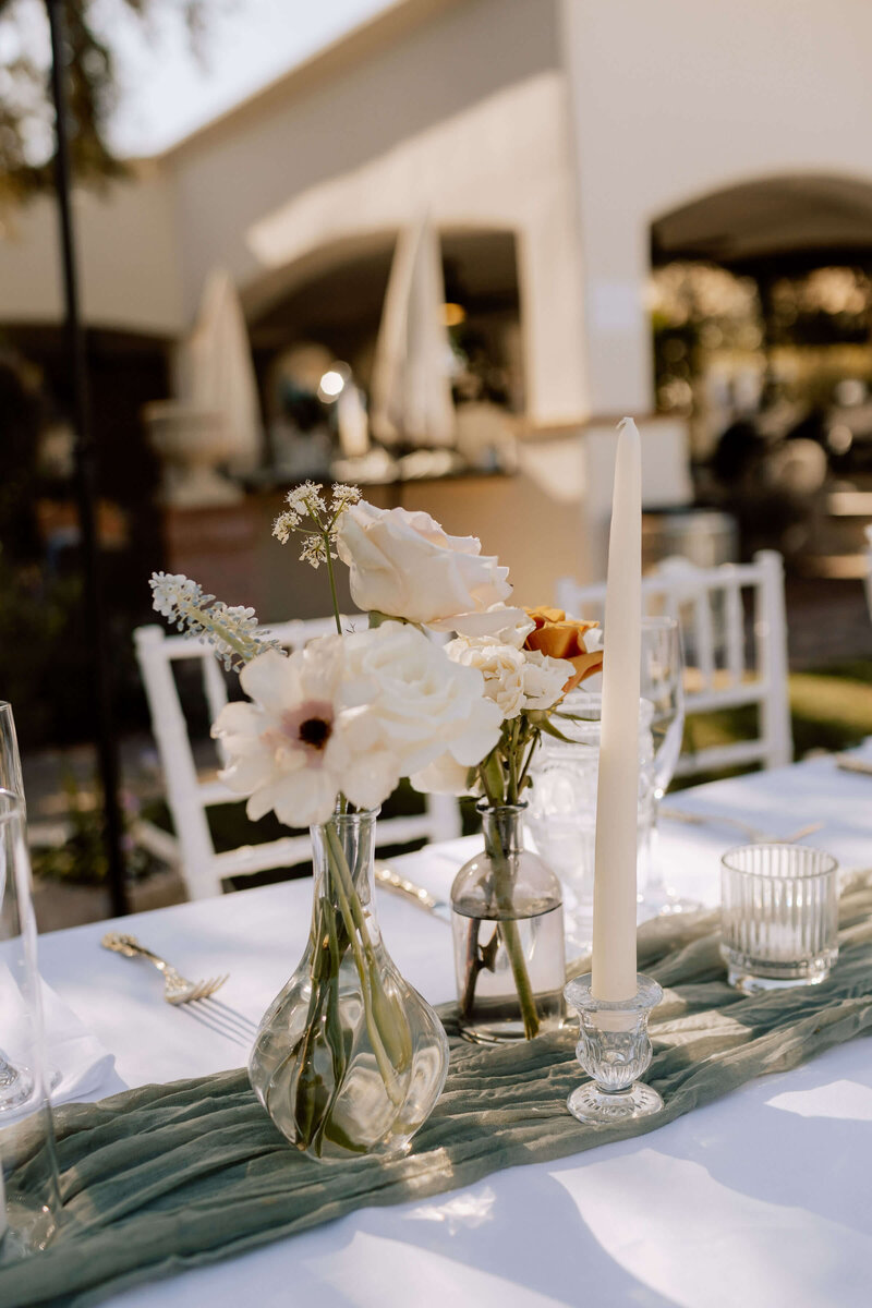 Beautiful Catholic wedding reception decor with flowers and candles