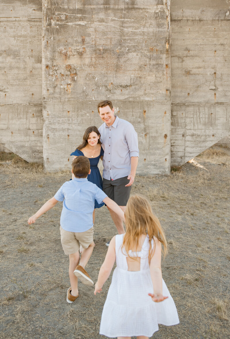 Family running by the beach