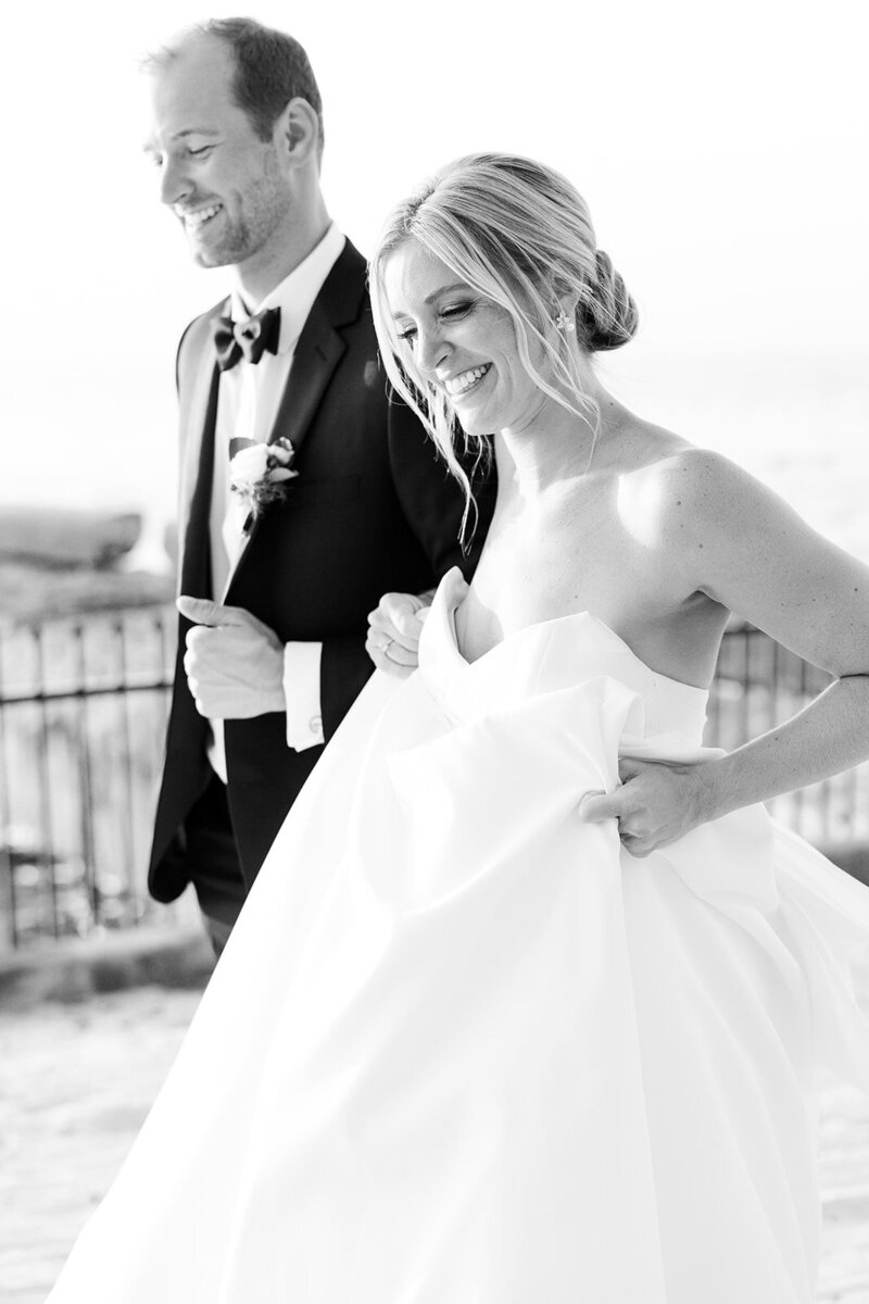 bride and groom walking on their wedding day at Shoreby Club in Cleveland Ohio