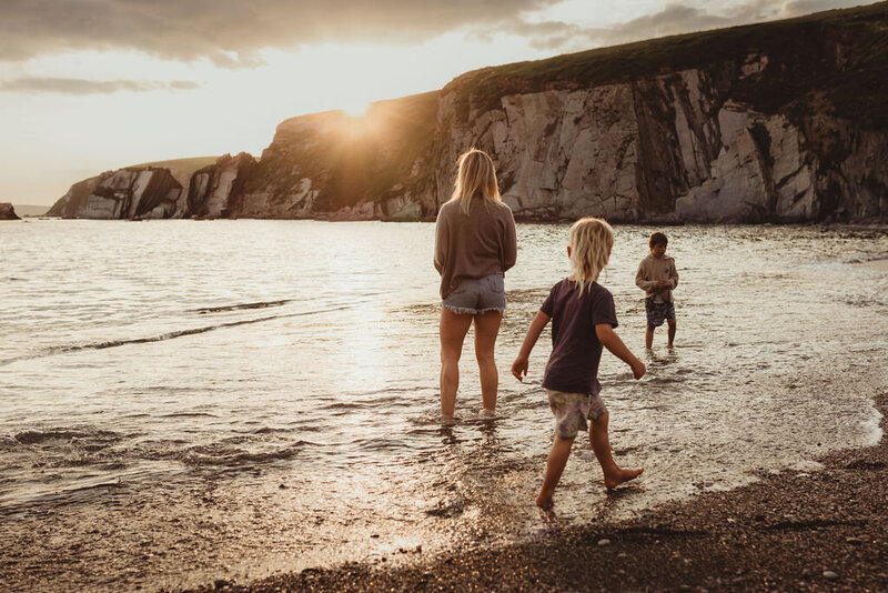 Family photograph of a Northern Rivers mother and her children in the ocean