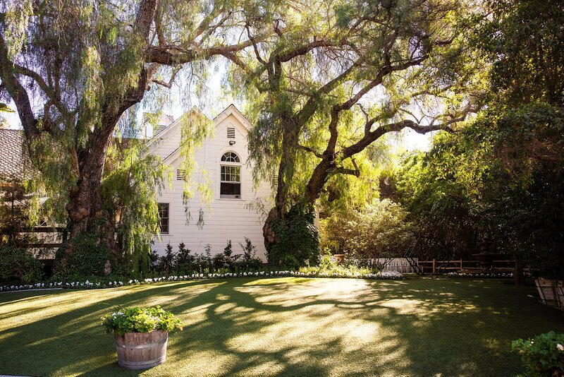 A secluded lawn area behind the Historic Schoolhouse at Green Gables Wedding Estate in San Marcos, California.