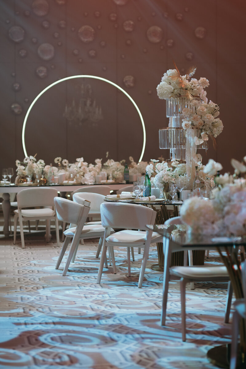pink bridal shower arches decorated with white roses