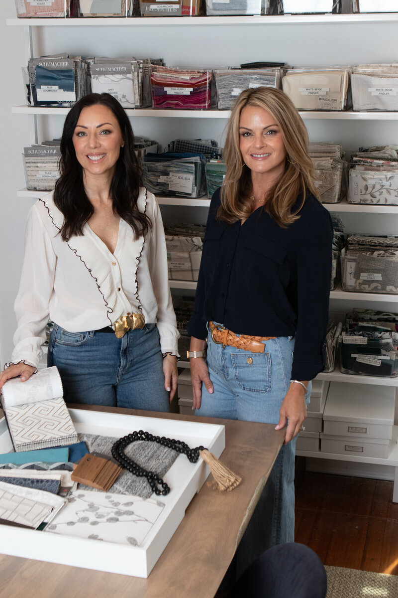 Kate Lee and Leanne Tuzza in their store The Curated Home sorting through fabric