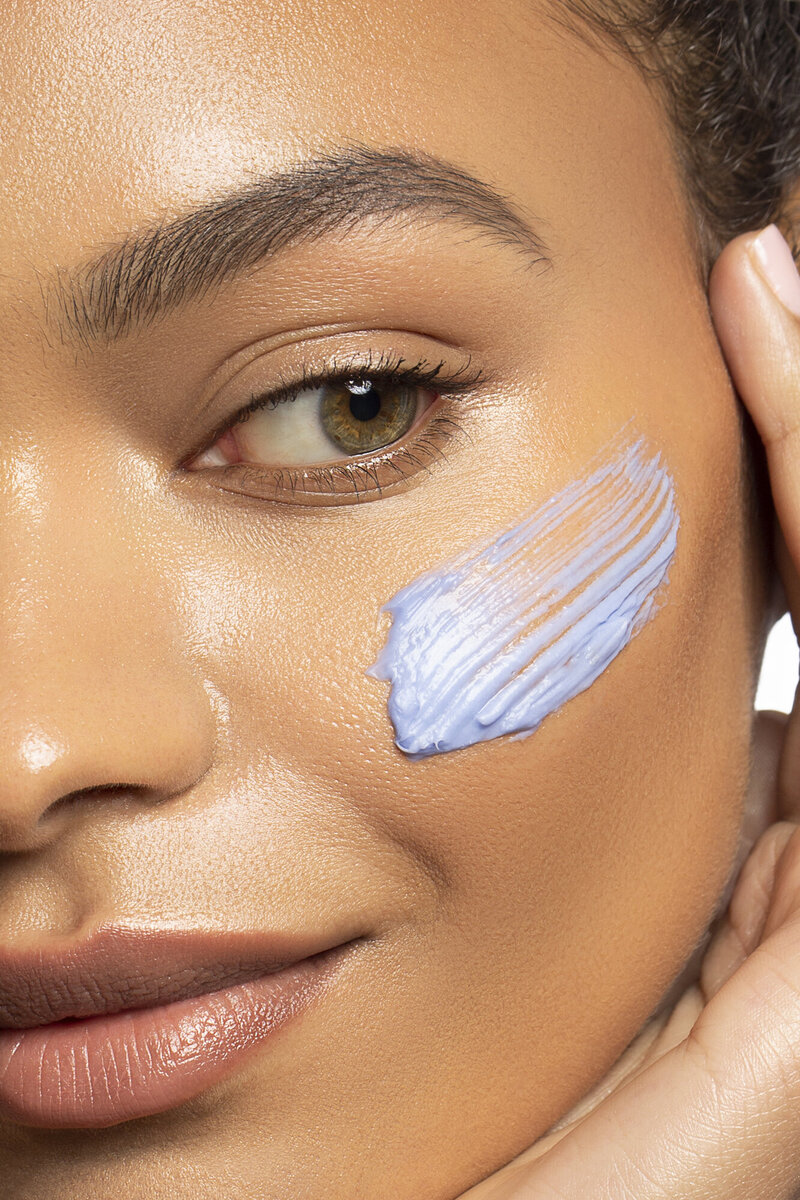 woman with blue skincare applied to face los angeles photographer