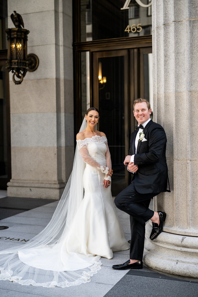 Elegant wedding reception first dance at Julia Morgan Ballroom in San Francisco, featuring ornate coffered ceiling, crystal chandeliers, and romantic lighting - professional Bay Area wedding photography by Duy Ho