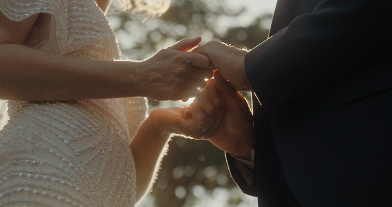 bride and groom holding hands