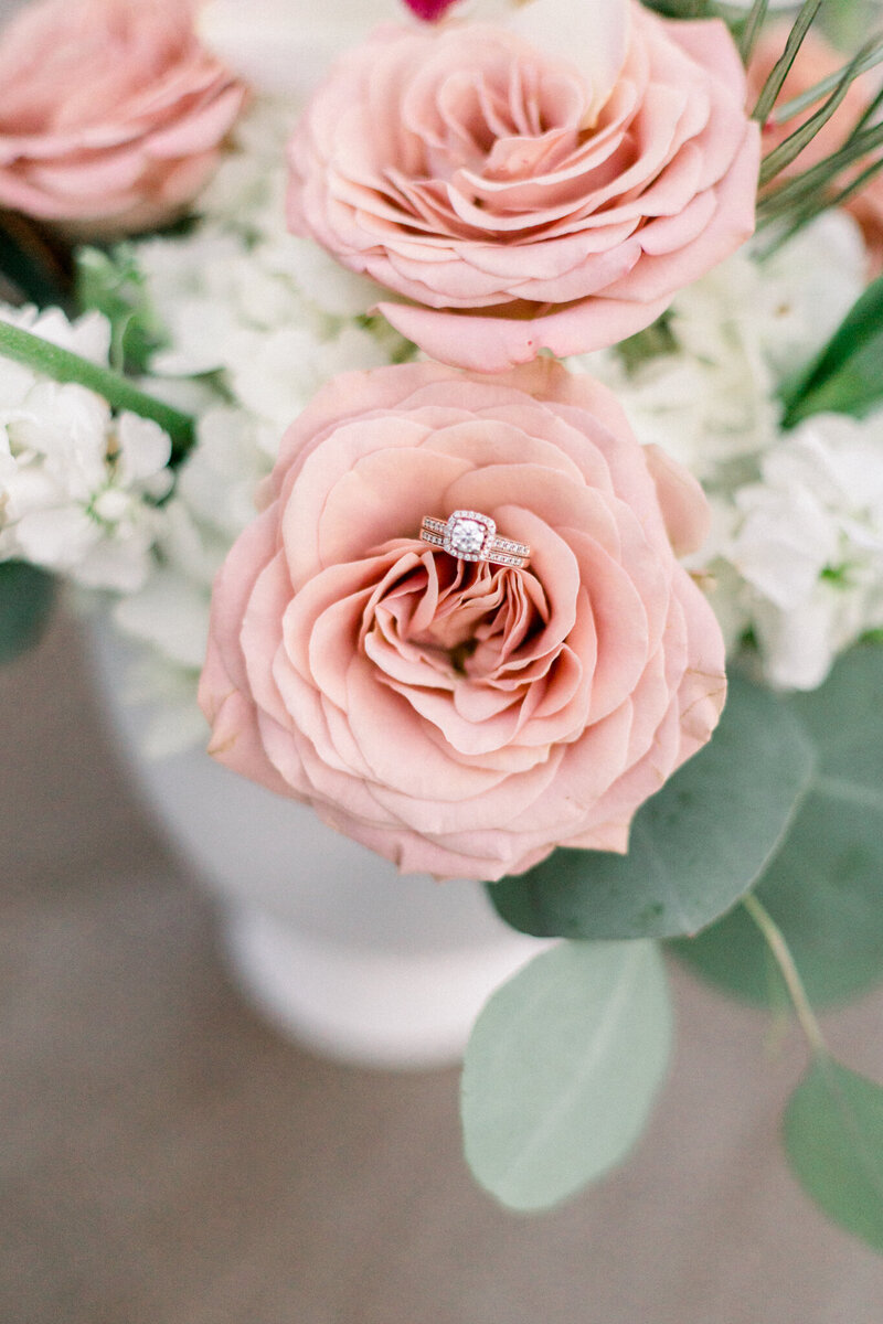 Wedding ring in a pink pastel flower bouquet