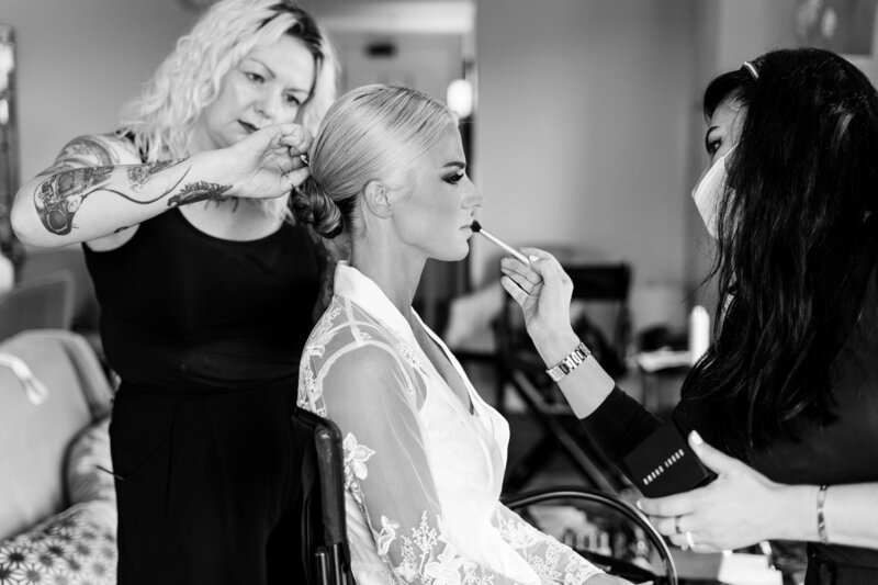bride getting hair and makeup