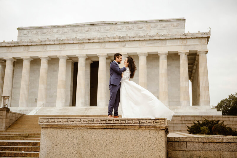 Bride and groom stand in front of the Lincoln Memorial during their Washington DC Elopement