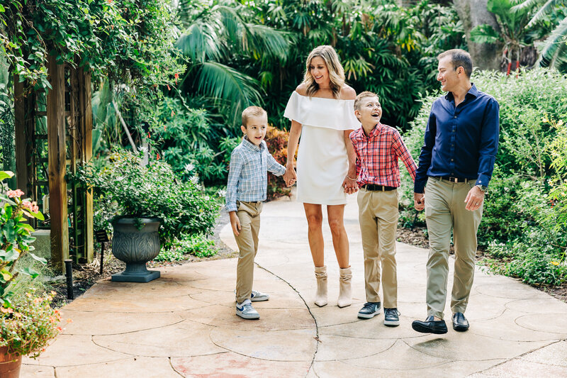 Candid family holiday photos at USF St. Pete’s beach area with picturesque views.