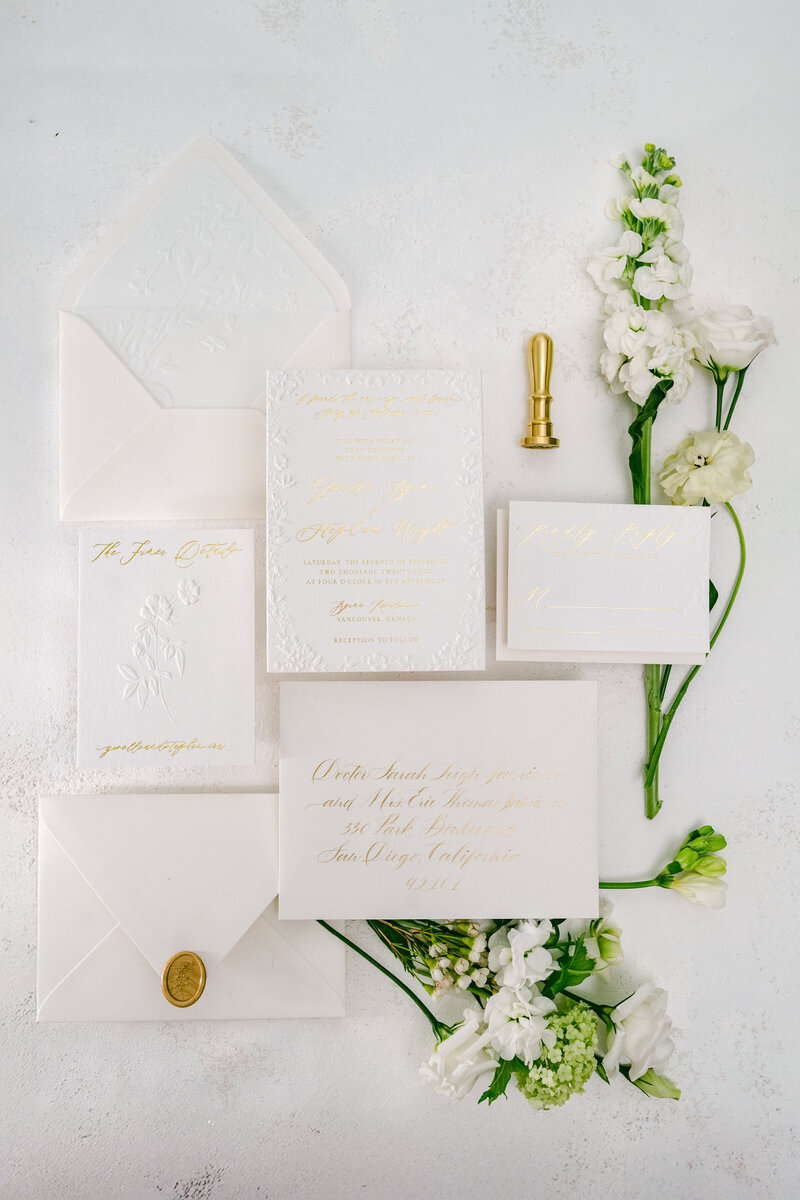 White and gold wedding invitation
