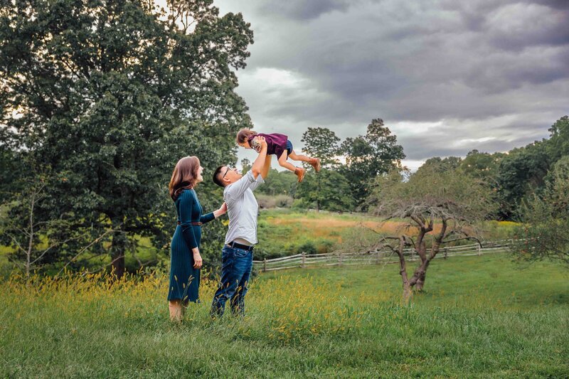 son hugging moms leg long island family photo session