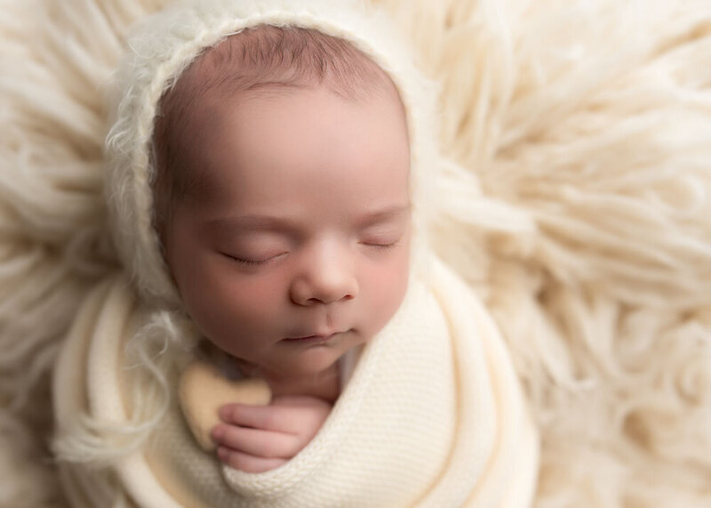 newborn-mini-session-cream-swaddle-headshot