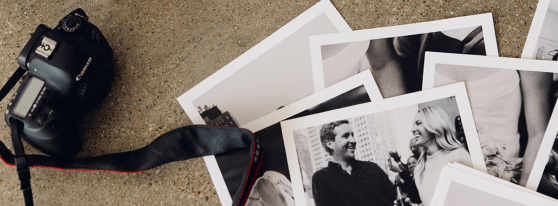 Group of images on the floor with a camera