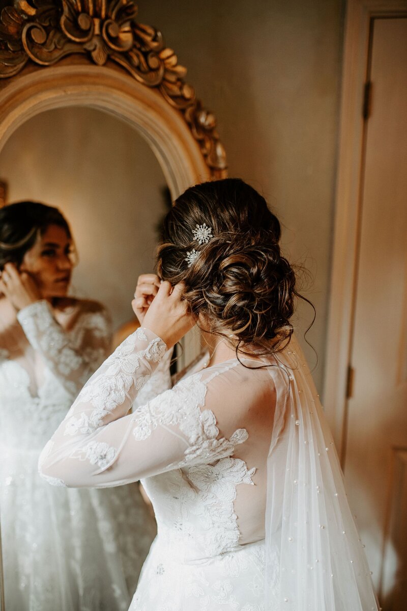 Professional wedding hairstylist creates elegant updo for bride's special day