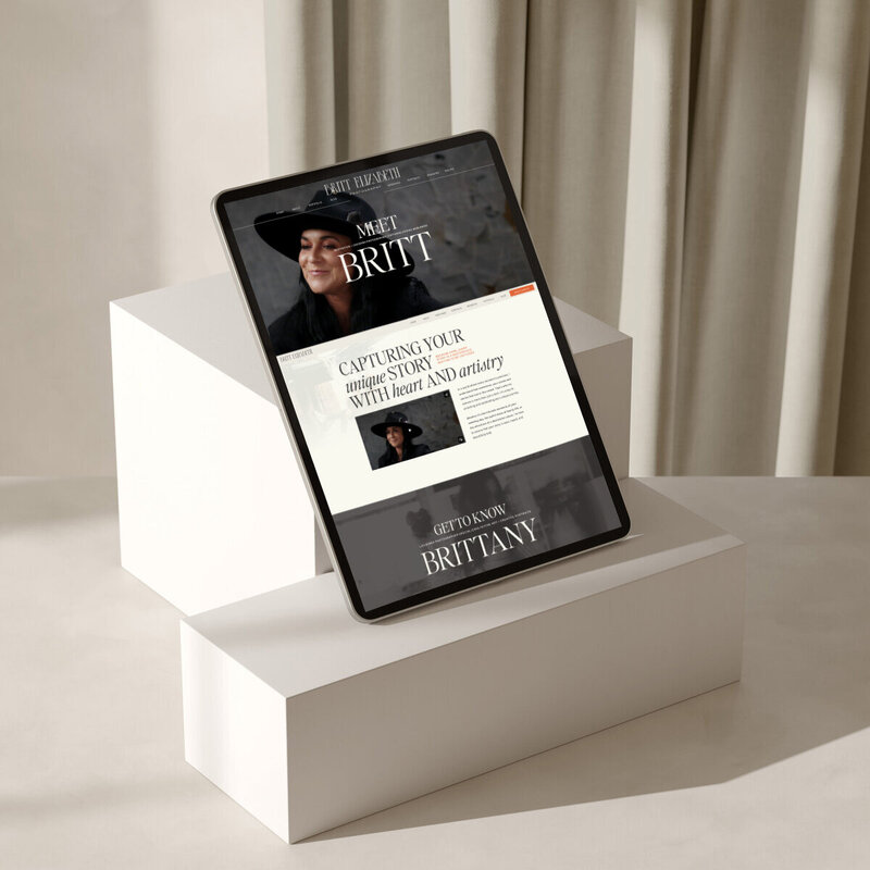 Mockup on an iPad of a beautiful brand and website design crafted by expert Showit Designer and Brand Designer Bayou Brand House for Britt Elizabeth Photography.