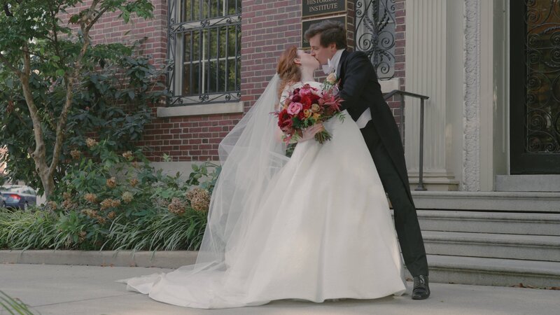 Erin dips Sam and share a kiss in front of the vintage doorsteps of dupont circle in washington dc
