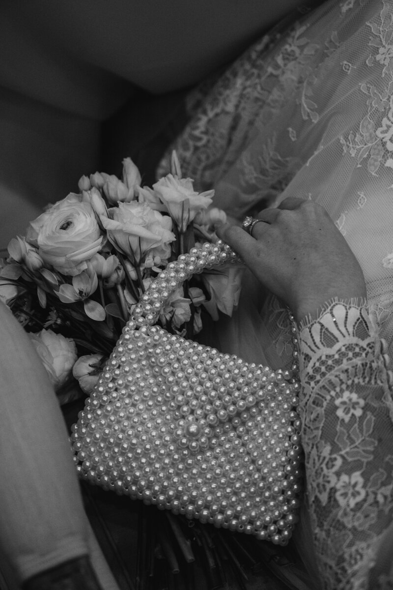 Bride holding pearl purse
