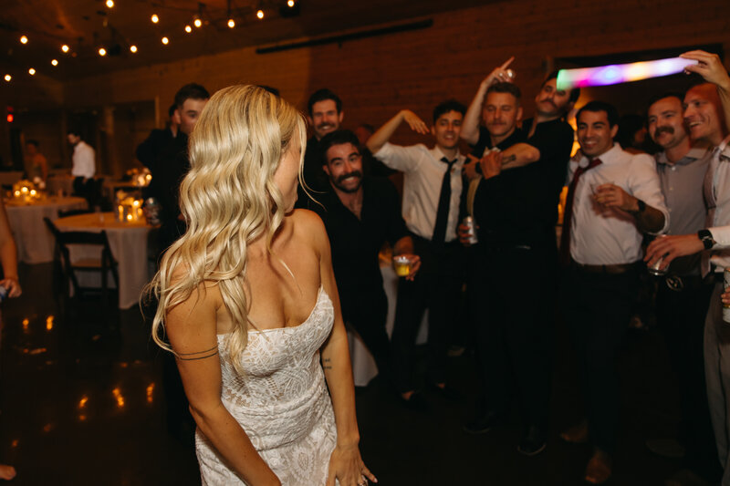 bride and friend dancing at wedding reception