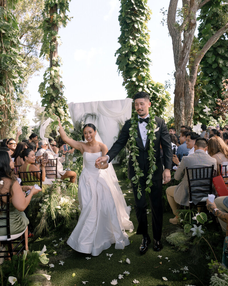 Candid wedding photo of couple’s laughter captured by Oahu photographer