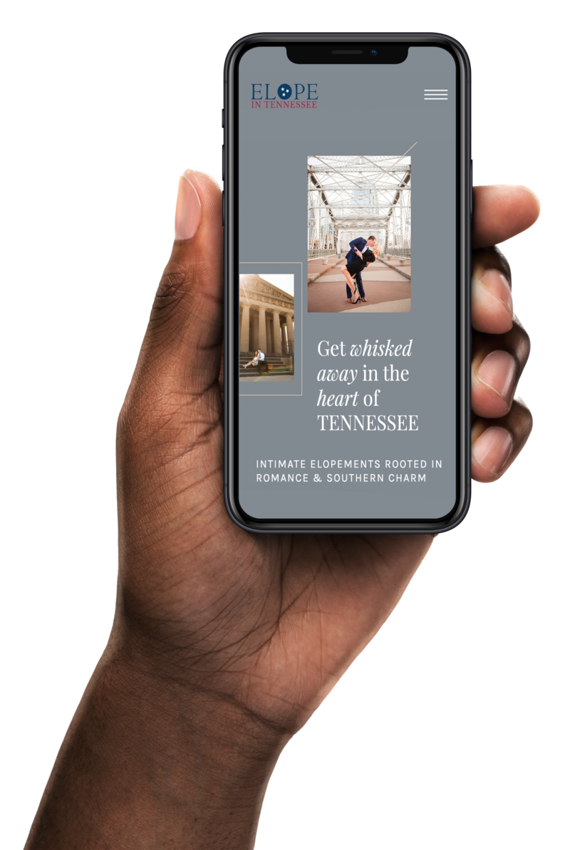 Guy's hand holding an iphone with an elopement company website on the screen