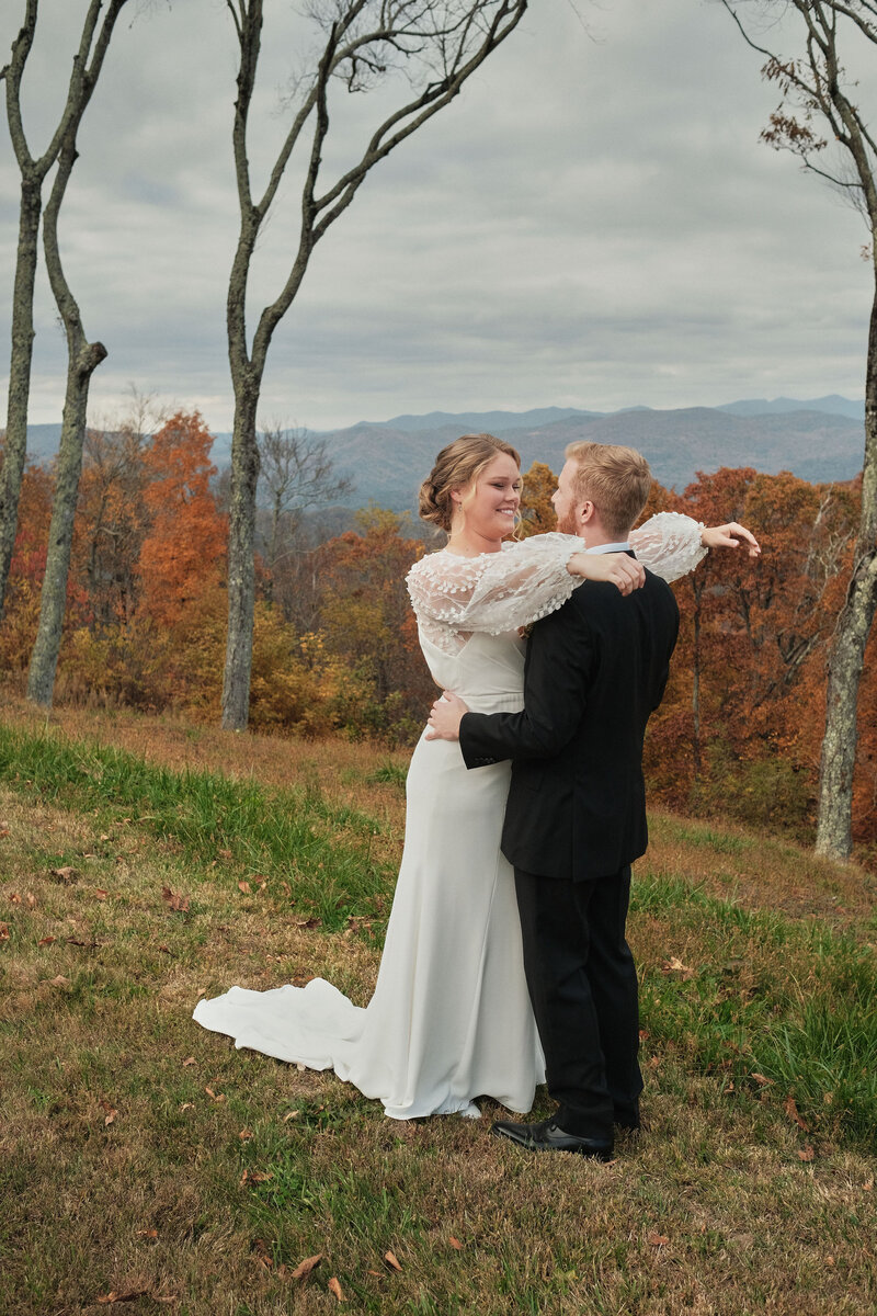 Couple laughing together in their wedding attire