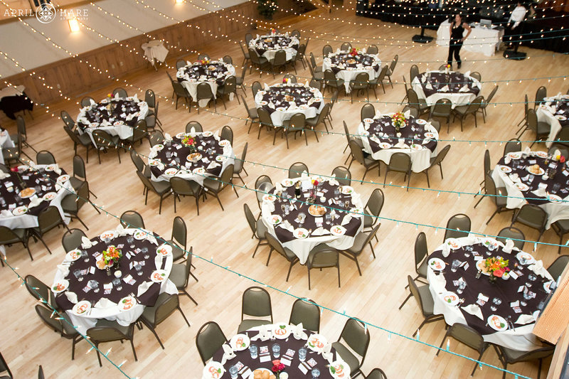 View of wedding reception set up with round tables at a Colorado reception