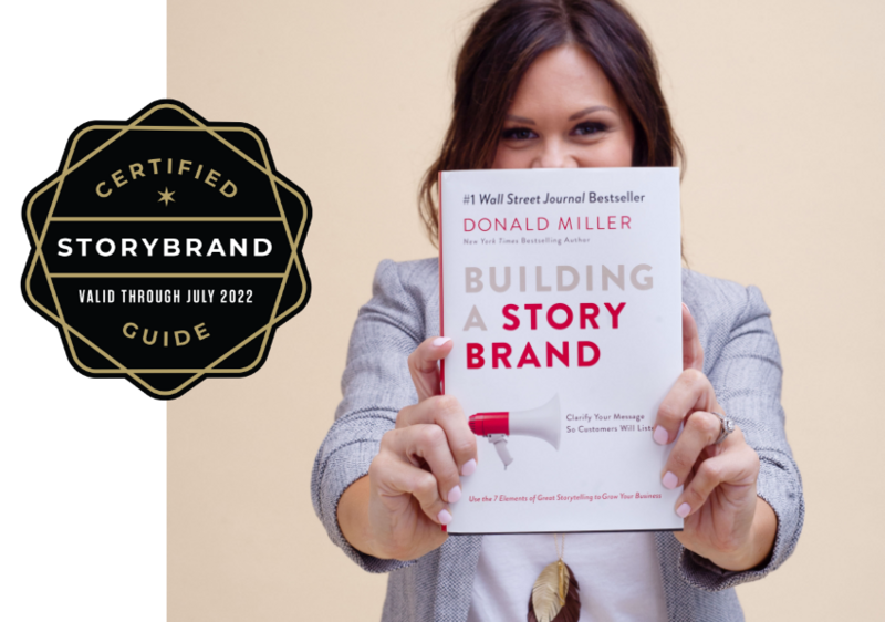 Jena holding a copy of the book Building a StoryBrand by Donald Miller