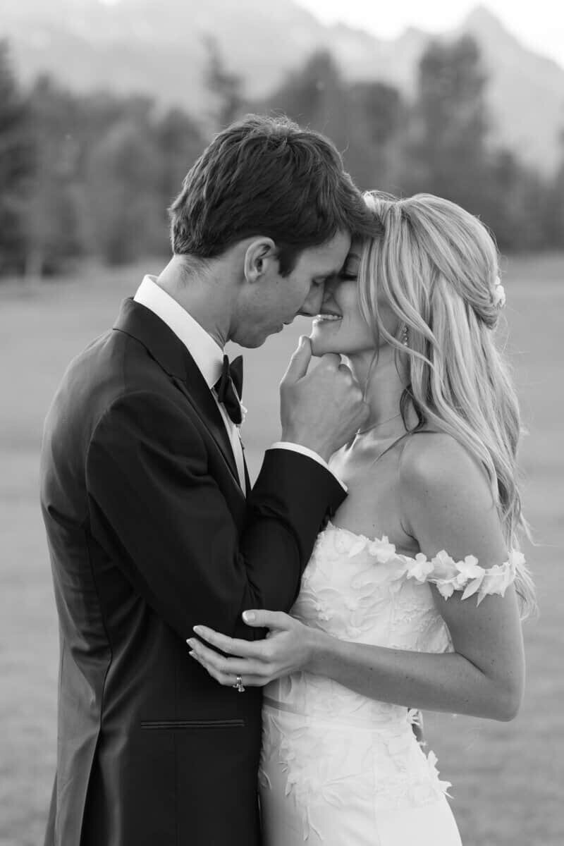 bride and groom are sharing a kiss at their destination jackson hole wedding