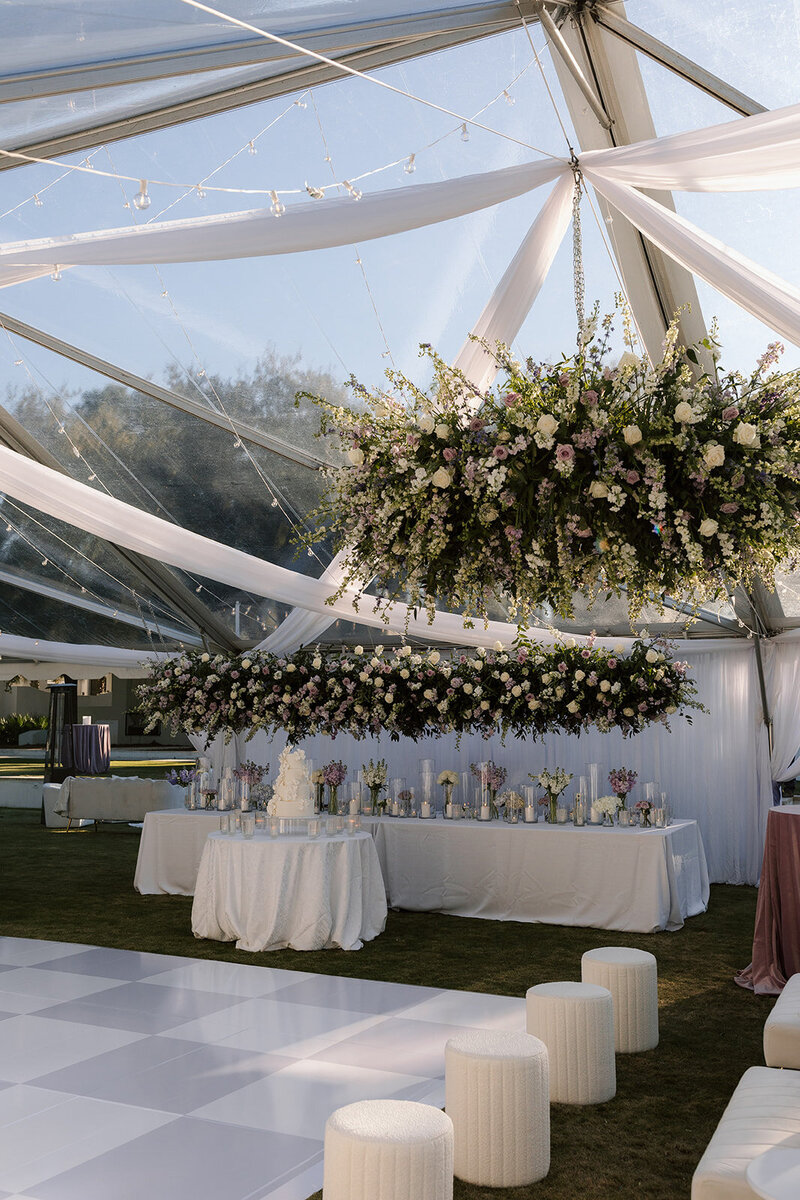 stunning wedding reception display with hanging florals and custom dance floor