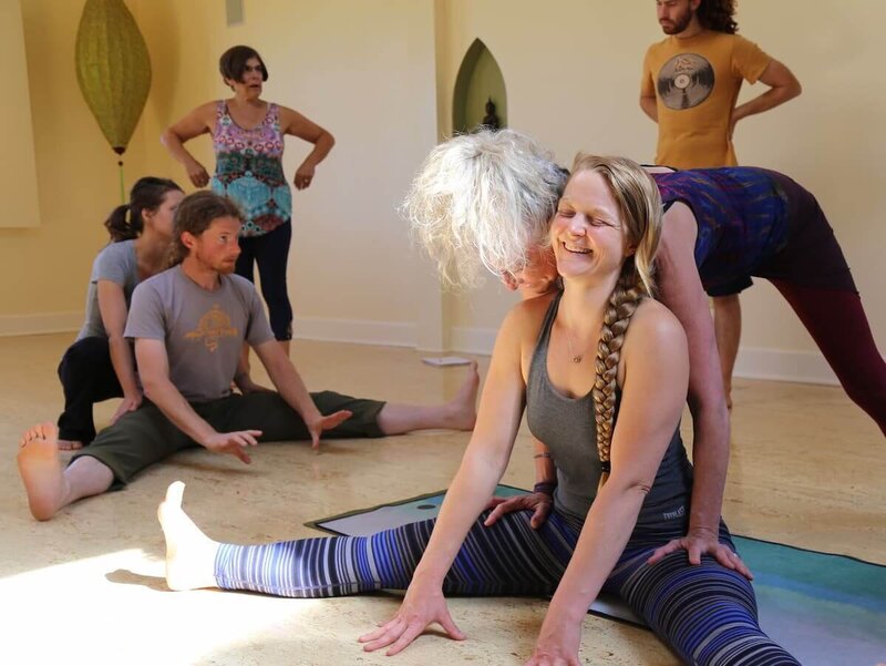 Instructor demonstrating hands-on adjustment techniques.
