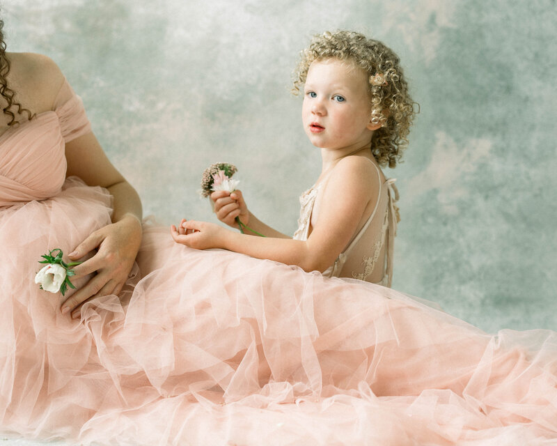 Elegant maternity portrait in minimalist studio with handmade backdrop — Miami maternity photographer Sandra Vallejo