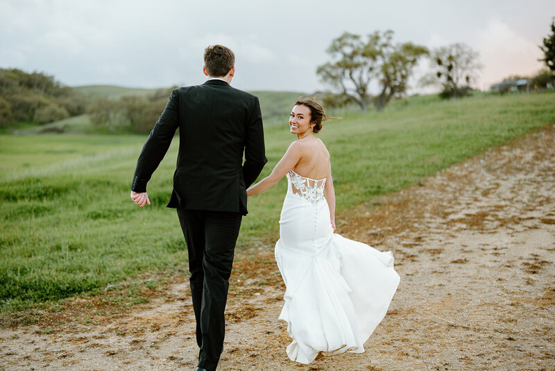 bride and groom sitting on a couch
