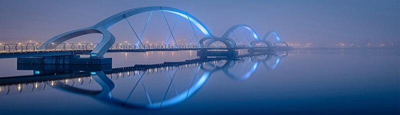 Decorative image of a long blue bridge  symbolizing the bridge between questions and answers