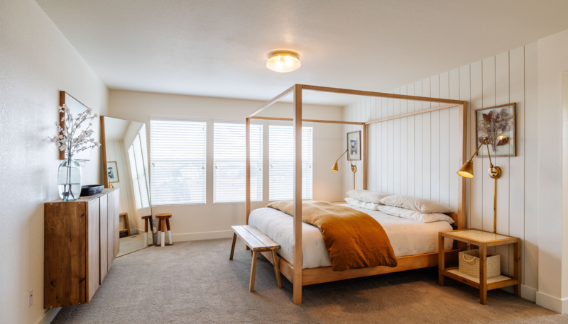 Bedroom with 4 poster bed and dresser